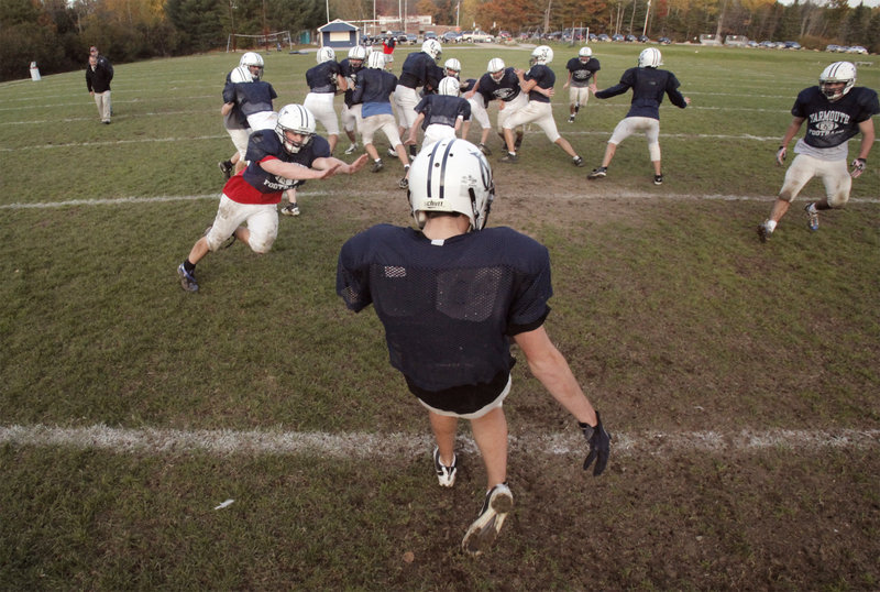 Yarmouth is one team that has emphasized special teams, especially blocking punts. In one drill, Billy Clabby puts a rush on punter Bryce Snyder.