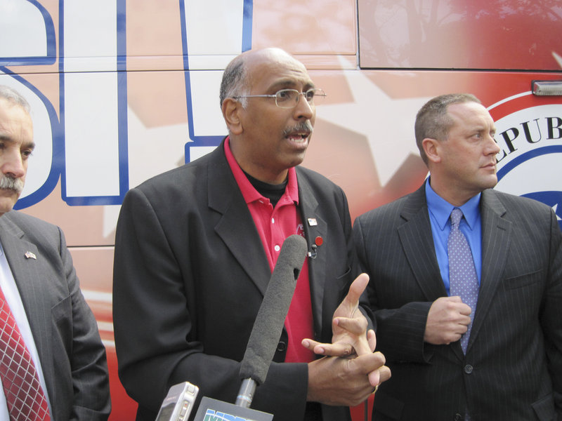 RNC chairman Michael Steele speaks to the media in front of the bus, which is part of a campaign to visit 48 states and 100 cities before Election Day.