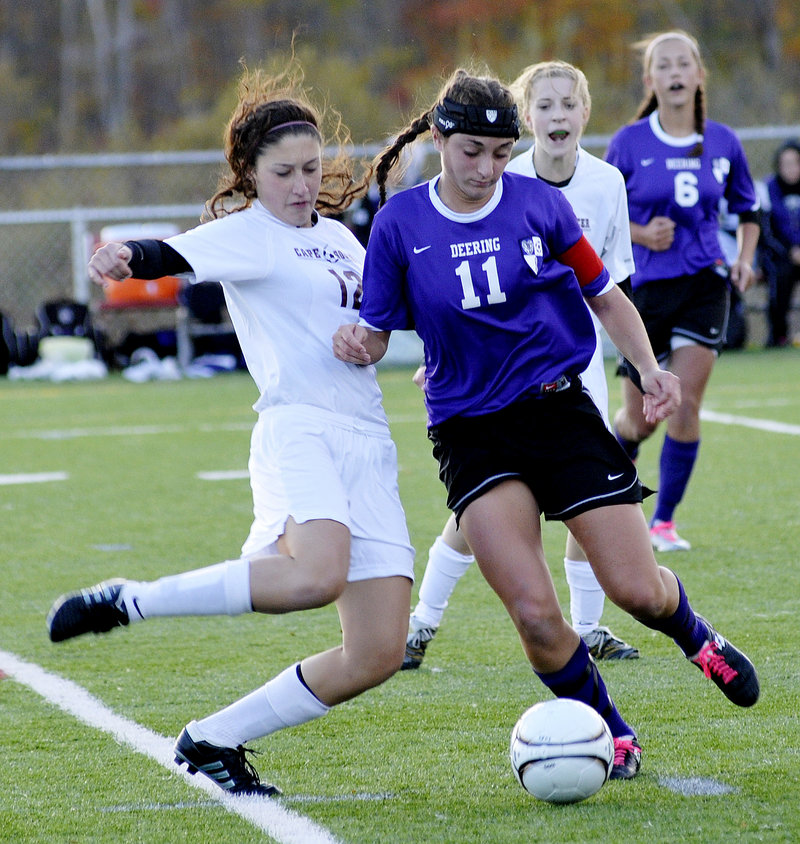 Amanda Masse of Deering attempts to advance the ball Friday as Hannah Dineen of Cape Elizabeth attempts to knock it away during the first half of Cape Elizabeth s 1-0 victory in a Western Class A girls' soccer prelim game.