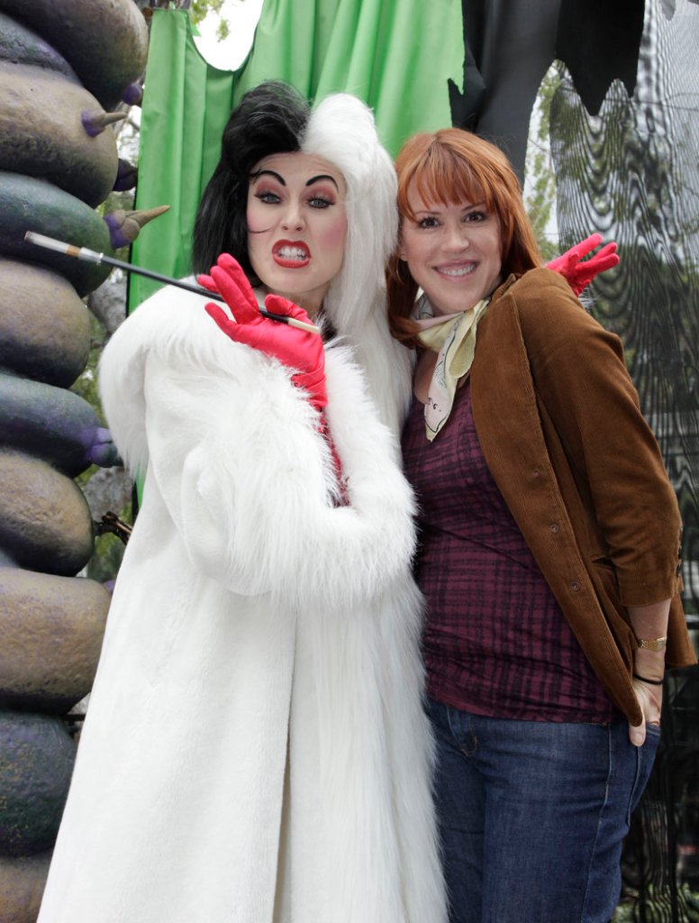 Actress Molly Ringwald poses with the Disney character Cruella de Vil at Disneyland in Anaheim, Calif., on Friday, during a visit to the resort’s “Halloween Time” celebration, running through Oct. 31.