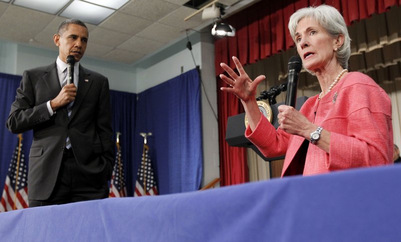 President Barack Obama listens as Health and Human Services Secretary Kathleen Sebelius speaks in Wheaton, Md., on June 8. During the health care reform process, insurers backed Democrats and got what they wanted: a federal mandate that most Americans carry health care coverage.