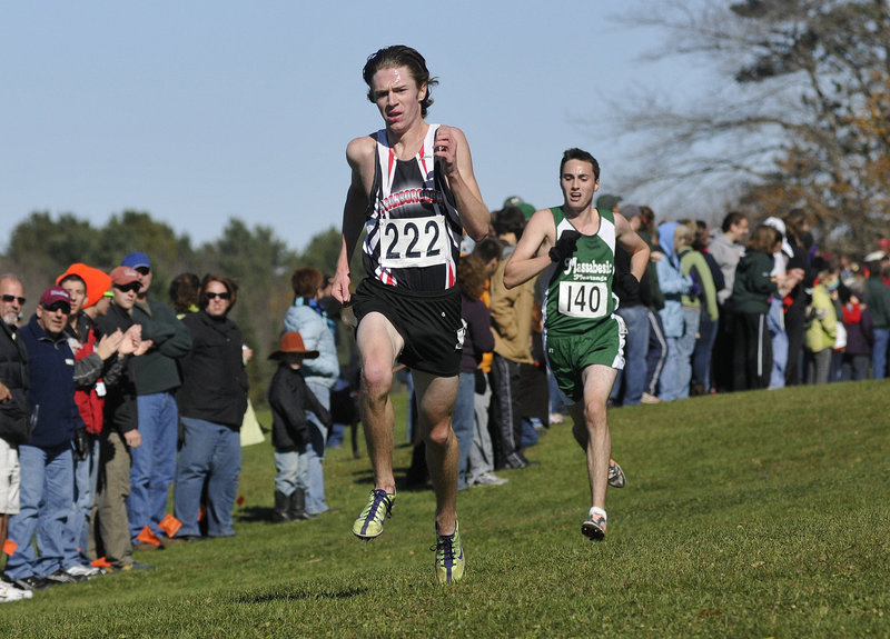 Nick Morris of Scarborough is on his way to victory over Jakob Brooks during the cross country regionals in Cumberland on Saturday. Morris won the Class A race in 16:59.30.