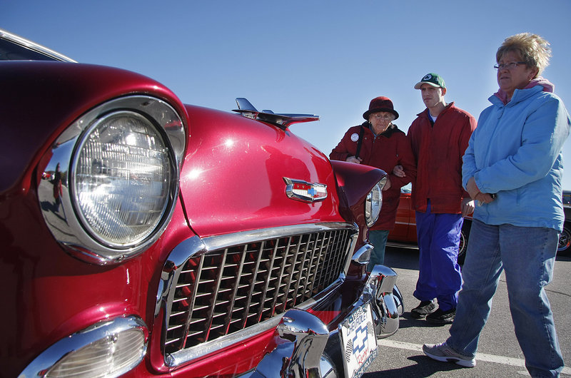 Barbara Kirkpatrick, left, David Van Goozen and Karen Kirkpatrick admire a 1955 Chevy Bel Air in the Classic and Antique Car Show.