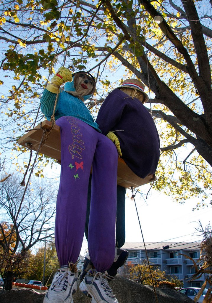 A pair of scarecrows swings in front of Anchorage by the Sea.