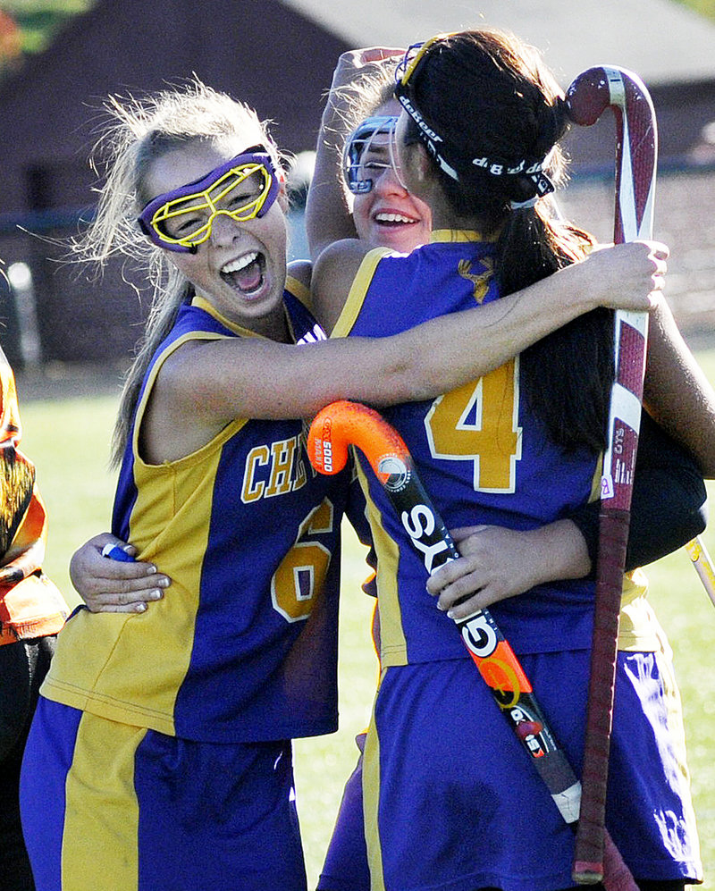 It was celebration time Saturday for the Cheverus field hockey team after the 2-1 victory against Scarborough in the Western Class A semifinals. From left to right are Catie Walsh, Annie DiLisio and Gabi Cardona. The Stags will meet Bonny Eagle for the title.