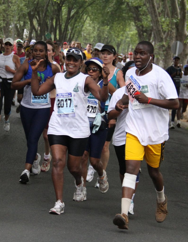 Orah Bessit, 66, left, participates in a road race in Johannesburg in September. Bessit, who grows her own vegetables, walks and runs, has given up hamburgers and switched from white to whole-grain bread.