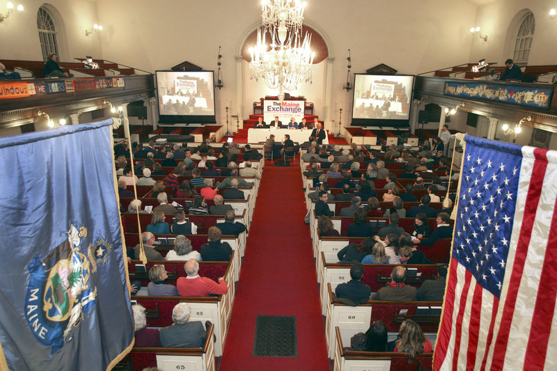 A packed house watches The Maine Exchange debate Saturday, which focused on education, energy and economic issues.
