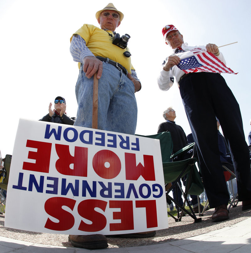 Dave Willett, left, and Tom Shea take part in a tea party rally in Buffalo, N.Y., in April. Research by The Washington Post showed the group to be a disparate band of vaguely connected gatherings that do surprisingly little to engage in the political process.