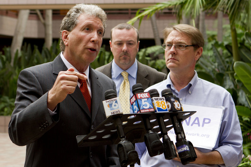 Attorney Irwin Zalkin, left, alongside David Clohessy, right, national director of the Survivors’ Network of those Abused by Priests, and attorney Anthony DeMarco, speaks Sunday in San Diego after the release of previously sealed church documents that detail sexual abuse complaints against priests.