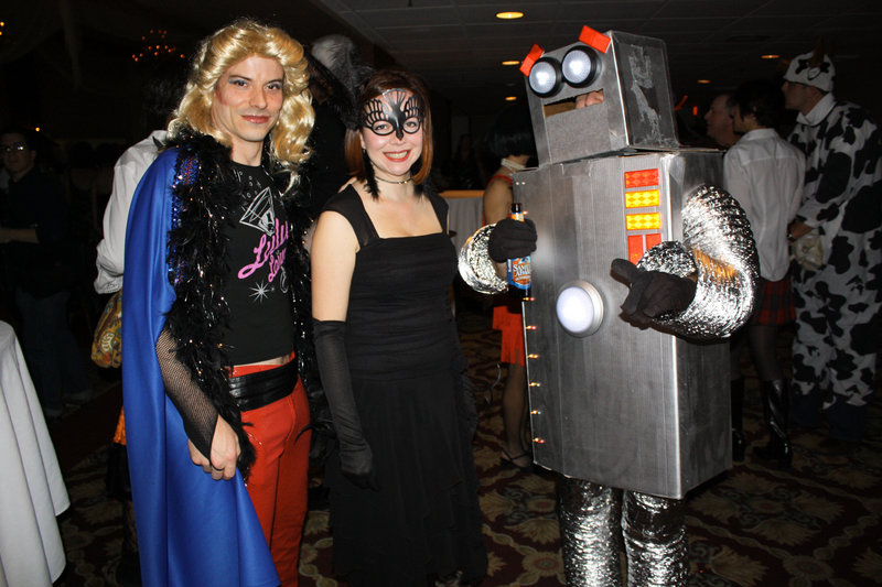 Joel Marquis, who won the award for Best Goodwill Find dressed as the lead from “Hedwig and the Angry Inch,” Carol Hammond, dressed as a raven, and Nate Butler, dressed as a robot