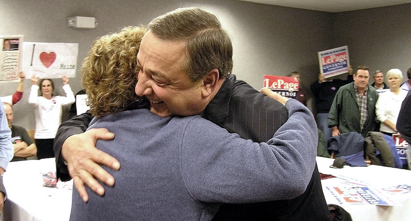 Republican gubernatorial candidate Paul LePage embraces a supporter Wednesday morning in a room at the Augusta Civic Center, where he received endorsements from some business leaders and the National Federation of Independent Business.