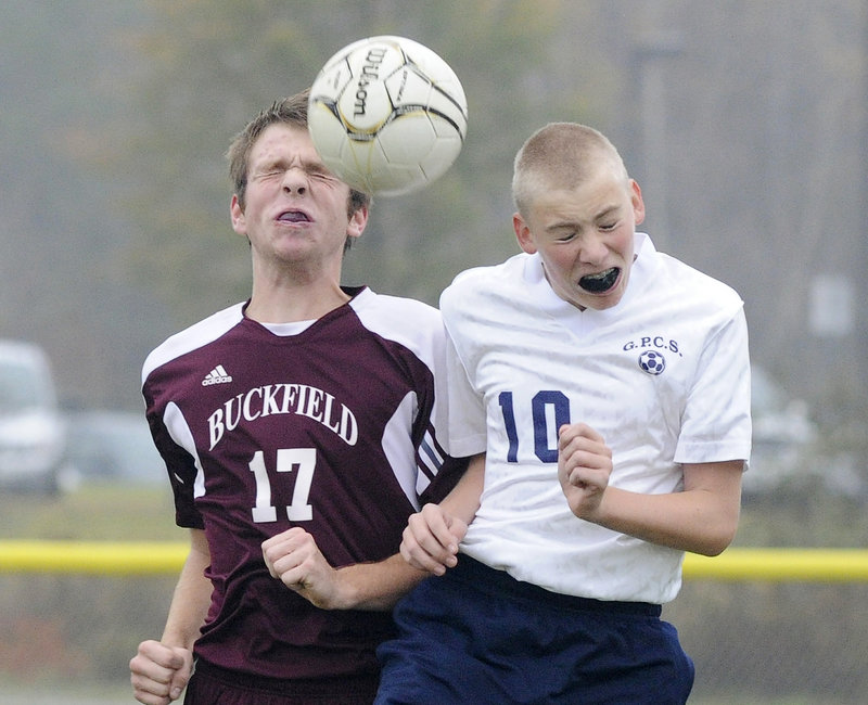 Derrick Belanger of Buckfield, left, and Eric Pearson of Greater Portland Christian go up for a ball Wednesday during their Western Class D quarterfinal in South Portland. Greater Portland Christian won 2-1 in the second overtime and will meet top-ranked Greenville in the semifinals.