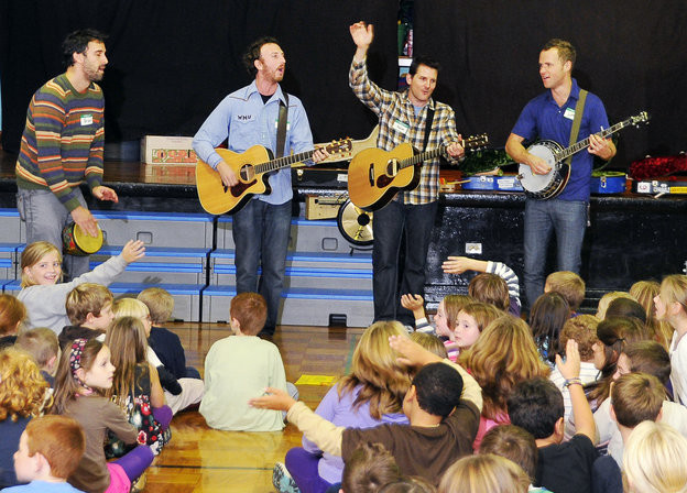 In this file photo, the band Guster performs at Longfellow Elementary School. The band is, from left, Brian Rosenworcel, Ryan Miller, Adam Gardner, who is from Portland, and Luke Reynolds.