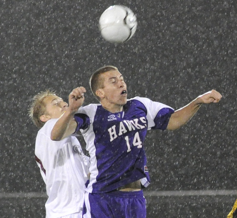 Tyler Hickey of Marshwood positions himself in front of Blake Barritt of Cape Elizabeth to unleash a header during the Capers' 5-0 victory in a Western Class A quarterfinal.