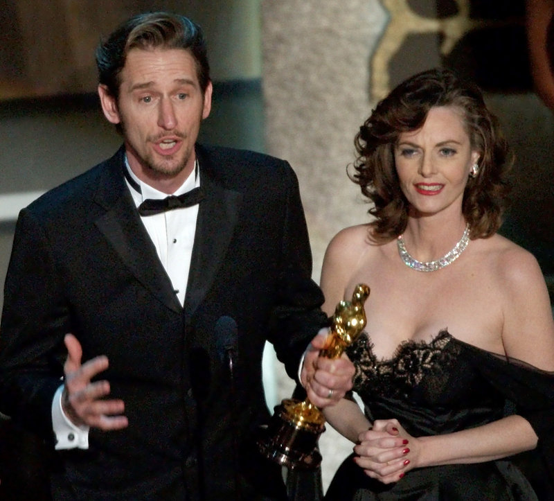 Lisa Blount and Ray McKinnon accept their Oscars for best live-action short film for "The Accountant" during the 74th annual Academy Awards, in Los Angeles in 2002.