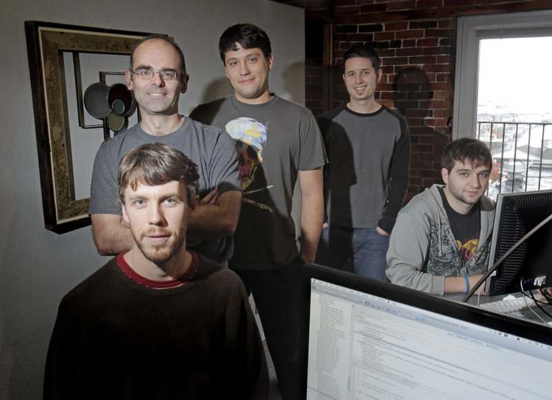The staff of Tap Tapas in Portland develops applications for the iPhone and iPad. From left are Billy Flaherty, Mark Woolard, Michael DeSouza, Justin Velgos and Jordan Sage.