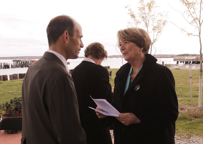 Candidate Libby Mitchell talks with Gov. John Baldacci at a groundbreaking ceremony at the Ocean Gateway terminal in Portland on Friday. Baldacci noted that Mitchell helped negotiate the bond issue that funded the pier project.