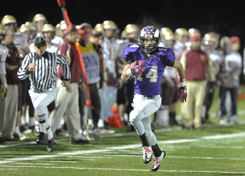 John Hardy of Deering breaks away for a touchdown on a 65-yard punt return Friday night the first score for the Rams in a 56-18 victory against Thornton Academy. Hardy also scored on a 46-yard pass as the Rams advanced to meet Bonny Eagle in the Western Class A semis.