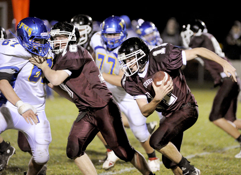 Mike Leeman of Greely follows a block by Tim Storey against Matt Darcy of Falmouth as the Rangers pick up yards Friday night. Falmouth won 15-14 on a 2-point conversion following a touchdown in the final minutes.