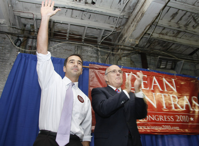 First District congressional candidate Dean Scontras waves to the crowd as he is joined by former New York Mayor Rudy Giuliani at a rally in Portland on Saturday.