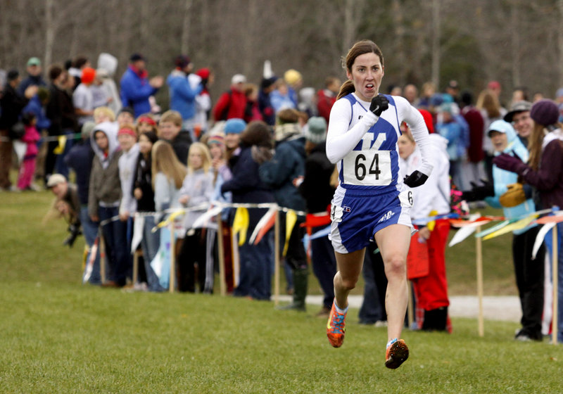 Abbey Leonardi of Kennebunk sprints to the finish to win Class A for the third straight year, just missing a course record.