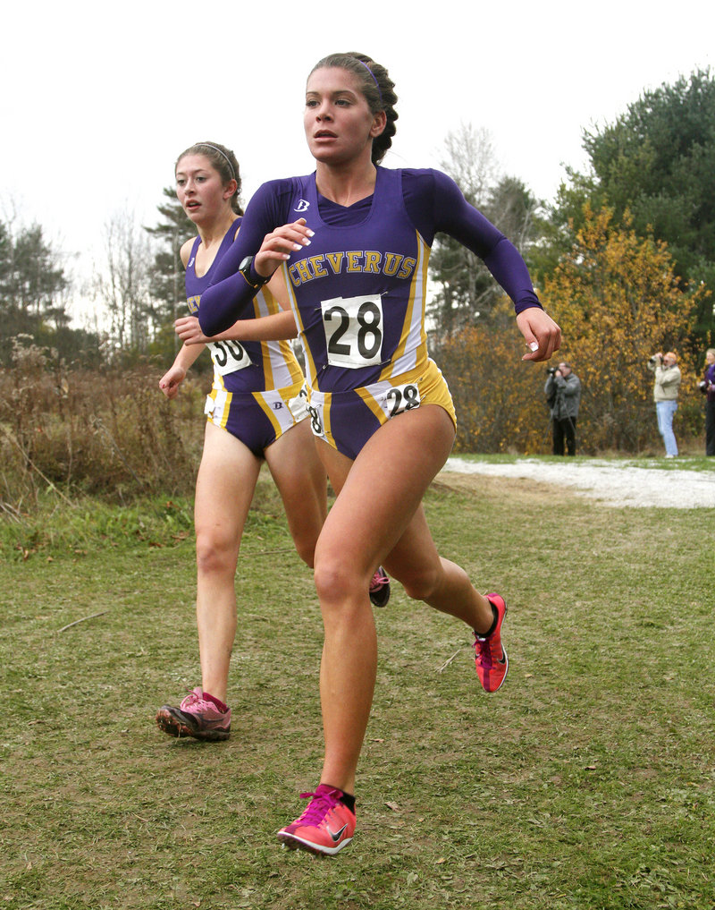 Emily Durgin, right, and Fiona Hendry dash down a hill en route to leading Cheverus to the Class A title.