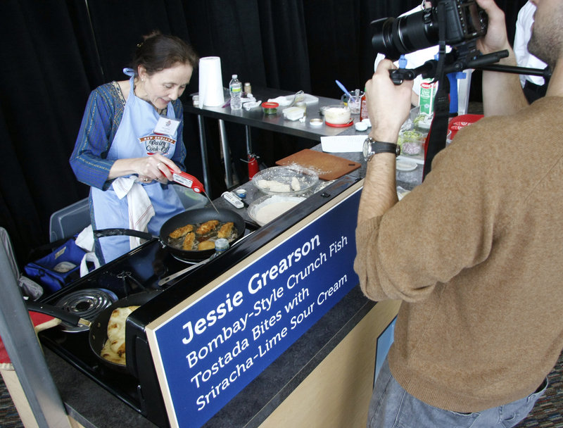 Jessie Grearson of Falmouth uses an internal thermometer as she creates her appetizer at the Hood dairy cook-off.