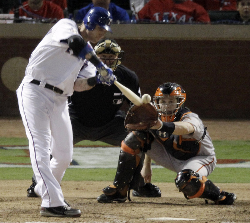 Josh Hamilton of the Texas Rangers hits a home run in the fifth inning of Game 3 of the World Series against San Francisco on Saturday. Texas won, 4-2.