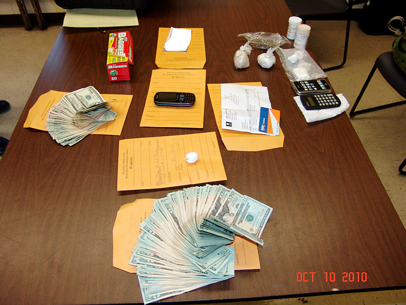 A South Portland Police photo of money and drugs seized in the bust.