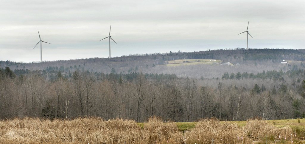 Three large wind turbines stand 384 feet above Beaver Ridge in Freedom.