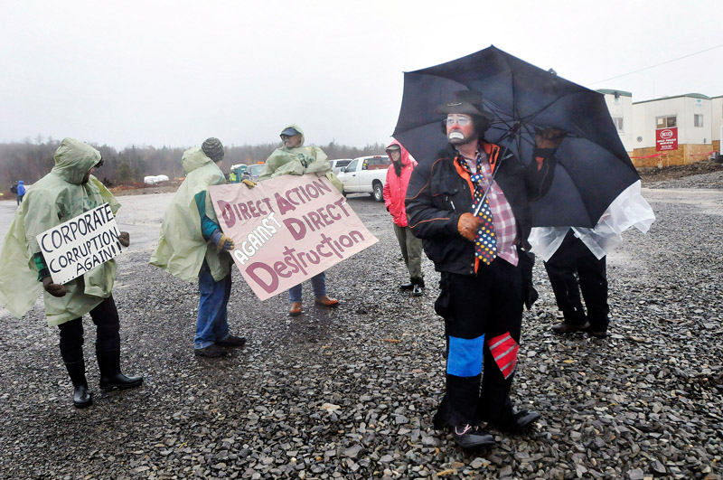Protesters outside Rollins wind energy project in Lincoln Monday, Nov. 8, 2010 including Don Thomas of Lincoln who dressed as a clown named Scruffy. Thomas was with Friends of Lincoln Lakes.
