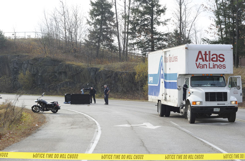 State and Portland police at the scene of a fatal motorcycle and moving truck accident at Skyway Drive and Congress Street in Portland this morning.