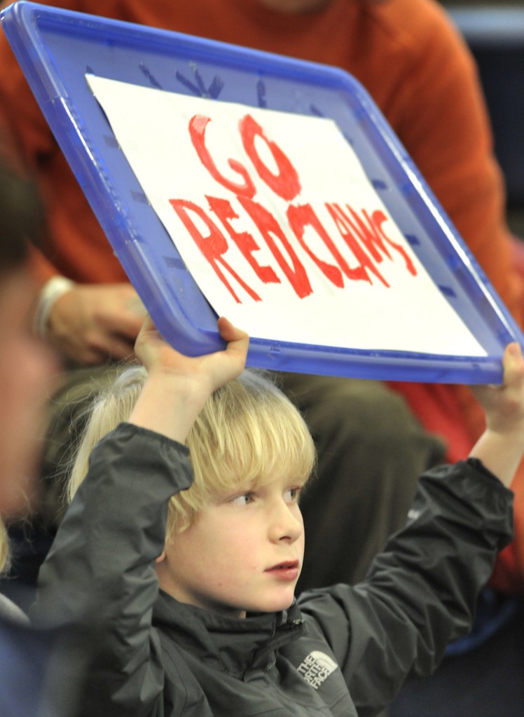 Darius Rieger, 9, of Cape Elizabeth, brought his own sign to support the Red Claws in their season opener at the Portland Expo.