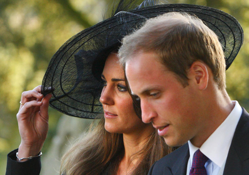 In this Oct. 23, 2010 file photo, Britain's Prince William and Kate Middleton leave the wedding of their friends Harry Mead and Rosie Bradford in the village of Northleach, England. According to an announcement from Clarence House in London, Tuesday Nov. 16, 2010, the couple are engaged, and will be married in 2011.