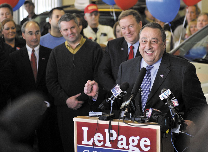 Gov.-elect Paul LePage speaks at a news conference in Waterville Nov. 3. Behind LePage, from left, are former gubernatorial candidate Bruce Poliquin, state Sen. Jon Courtney and state Sen. Kevin Raye.