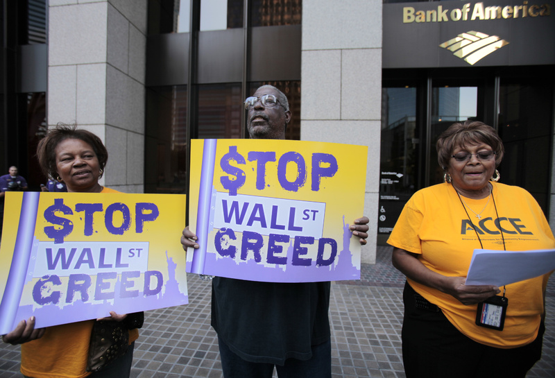 Members of Alliance of Californians for Community Empowerment protest outside Bank of America offices to demand banks' accountability, a foreclosure moratorium and loan modifications. From left are Betty Steele, Mabdullah Mohamed and Lyneva Mottley.