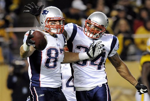 Tight end Rob Gronkowski, left, and running back Sammy Morris celebrate Gronkowski’s 19-yard touchdown catch from Tom Brady that gave New England a 7-0 lead in the first quarter. Gronkowski caught three TD passes as the Pats withstood the Steelers’ late rally in Pittsburgh.