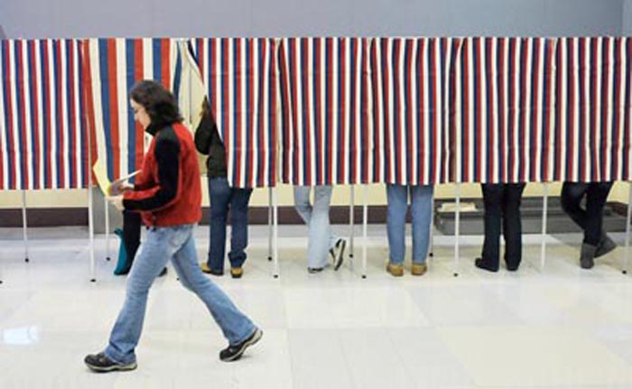 Portland residents cast their votes at the Merrill Auditorium Rehearsal Hall in Portland today.
