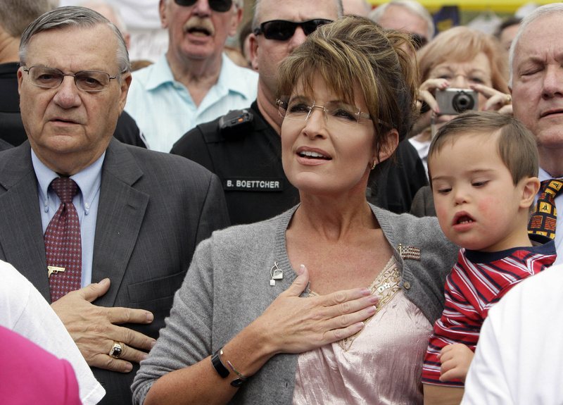 Former vice presidential candidate Sarah Palin, shown at a Tea Party Express rally in Phoenix in October, will be touring the country promoting her new book, "American by Heart."