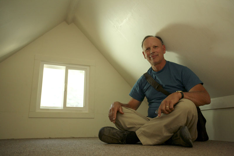 Stephen Marshall, owner of Little House on the Trailer, in the loft of one of his small houses in Petaluma, Calif.