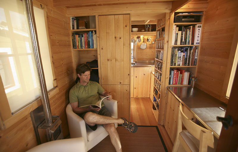 Jay Schafer sits in one of the homes he built for himself in Graton, Calif.