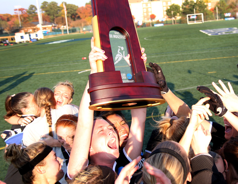 The Bowdoin College field hockey team celebrates after beating Messiah College on penalty strokes Sunday to reclaim the NCAA Division III title at Newport News, Va. The shootout broke a 1-1 tie after regulation and two overtime periods.