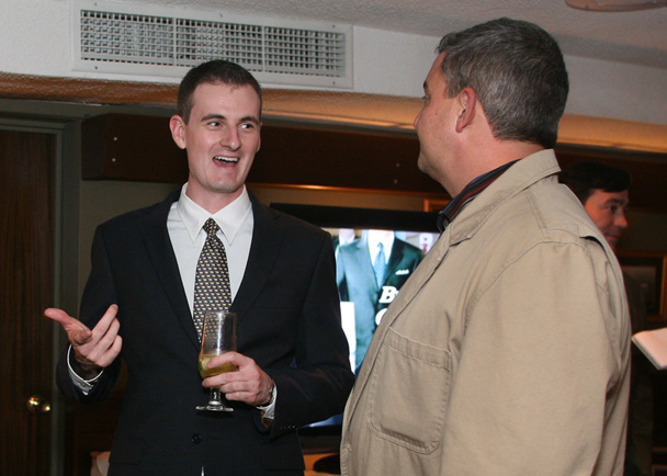 Chase Martin, Republican candidate for House District 115 in Portland, left, visits with Mark Ferguson of Poland Springs, during the Yes on 1 Four Season Resort and Casino reception at DiMillos Floating Restaurant in Portland.