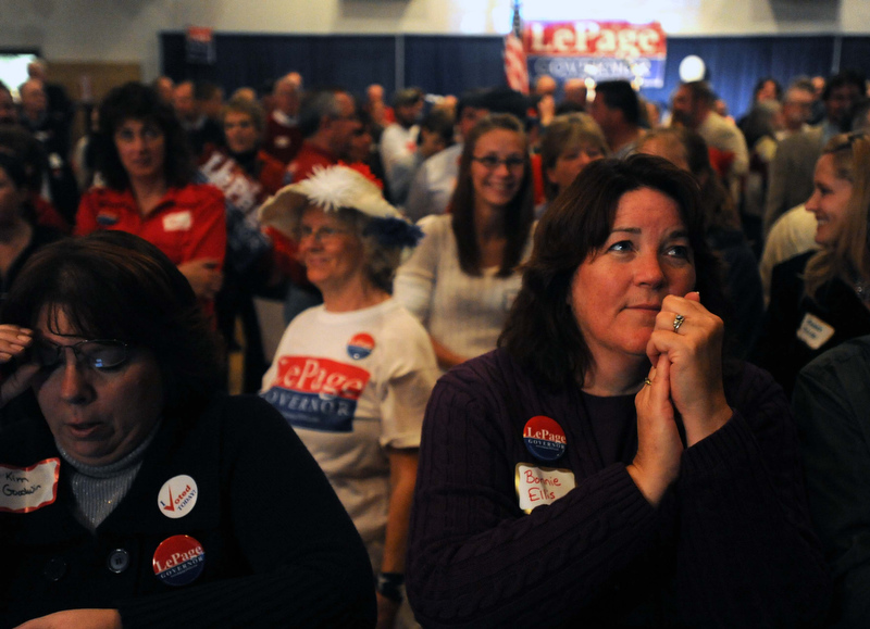Staff photo by Michael G. Seamans Paul LePage supporters watch as poll numbers roll in at the election night party at Champions in Waterville Tuesday night.