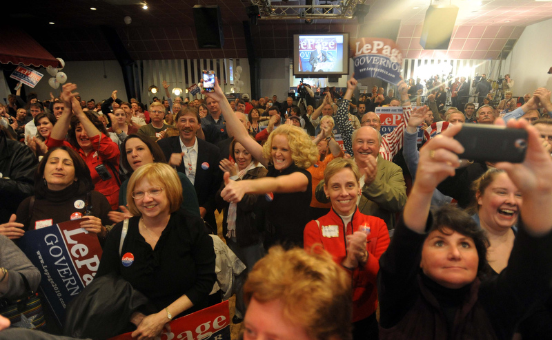 Staff photo by Michael G. Seamans Paul LePage supporters cheer as poll numbers roll in at the election night party at Champions in Waterville Tuesday night.