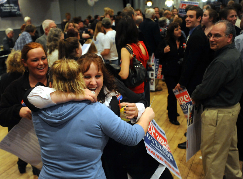 Staff photo by Michael G. Seamans Supporters celebrate as poll numbers roll in at the Paul LePage election night party at Champions in Waterville early Wednesday morning.