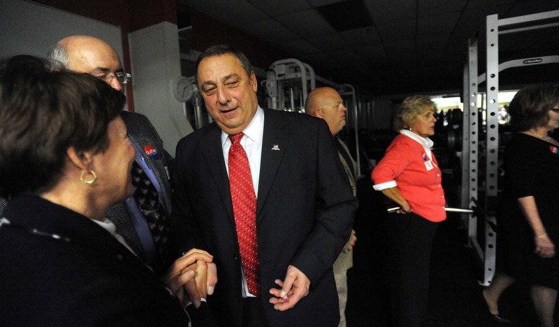 Staff photo by Michael G. Seamans Paul LePage takes a moment behind the scenes as supporters rally at the election night party at Champions in Waterville Tuesday night.
