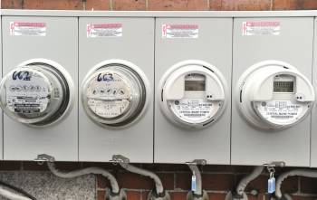 The new smart meters at right are replacing the older meter style at left.