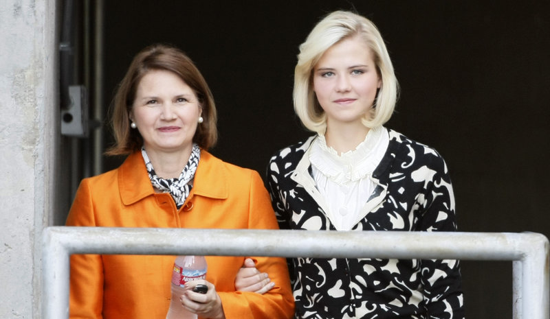Elizabeth Smart, right, walks out of the federal courthouse with her mother, Lois Smart, after testifying at a competency hearing for her alleged kidnapper, Brian David Mitchell, in October 2009, in Salt Lake City. His trial is due to start today.