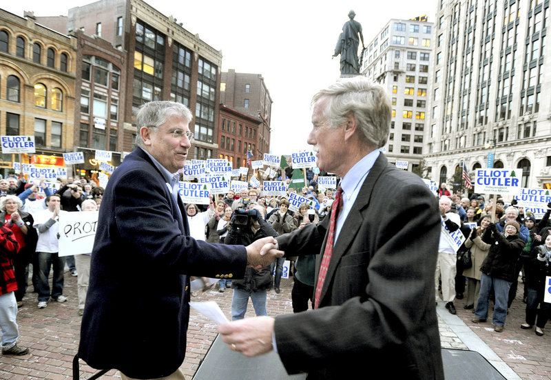 Independent candidate Eliot Cutler is introduced by former Maine Gov. Angus King, who also won as an independent, at a rally Monday afternoon in Portland's Monument Square.